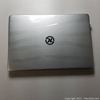 Top view of closed silver KUU Kbook Pro laptop showing KUU logo on lid