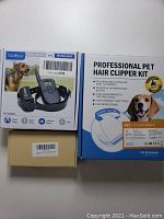 Box of Petainer rechargeable training collar PT998DB and professional pet hair clipper kit GD014C packaging