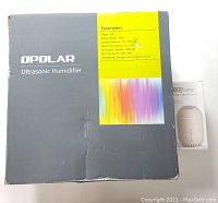 Opolar Ultrasonic Humidifier model H01BK box showing technical parameters and brand.