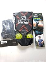 Photo showing all items in lot: Rhino Edge tennis rackets and balls, Benken knee guards in packaging, Teaforo tennis elbow brace set, wireless sports headwear in packaging