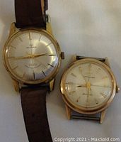 Front view of Helbros and Wittnauer watches showing dials and case shapes