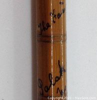 Close-up of bamboo rod blank with handwritten "the Hardy Palakona" signature and numbering