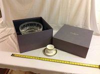 Centrepiece seated in original Waterford presentation box with lid beside it and measuring tape for scale
