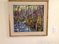 Full front view of framed painting hanging on wall