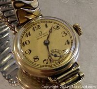 Close-up view of watch dial, hands and case profile
