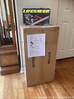 Overview of Celestron telescope shipping box and Lifesaver radio box