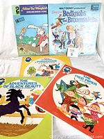 Five children's classic vinyl records displayed front-facing to show cover art including Alice in Wonderland, Bedknobs and Broomsticks, Pinocchio, The Adventures of Black Beauty, and The Pied Piper.