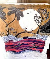 Photo of vintage Japanese batik fabric art with stylized boats, moon, palm trees, and floral motifs.