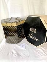 Two vintage hat boxes, one Stetson branded octagonal box and one smaller decorative box with rope handles