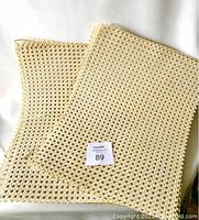 Eight pieces of beige caning sheets overlapping, displayed on white background.