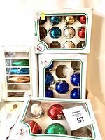 Photo of boxed vintage Santaland faceted glass Christmas ball ornaments in various colors: blue, red, green, gold, silver