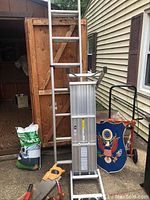Wide view showing both the aluminum ladder and the slim fold work bench, along with some other miscellaneous items.