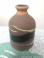Full view of the vintage Alfadom pottery vase highlighting its painted surface and shape.