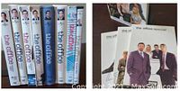 Box sets showing spines of U.S. seasons 1 to 8 stacked side by side and British version items including a special and book of scripts.
