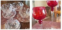 Two red textured glass decorative accent pieces with tall stems shown on table.