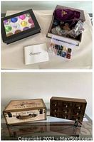 Overview of both storage boxes, assorted crystals and stones, and a box of large decorative glass gems.
