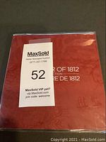 Sealed packaging of the War of 1812 Canadian commemorative coin set with red cover.