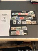 Full view of the collection of Iceland stamps displayed on black stock paper in rows.