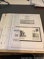 Photo of the first day cover album page featuring a mounted FDC with Canada Duck Stamp and descriptive panel about the conservation theme.