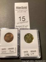 Two one-dollar coins in plastic holders, labeled with their dates (2010 and 2012) and grades (Fine, VF).