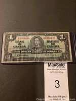 Front view of the 1937 Canadian one dollar banknote featuring King George VI, showing wear and creases but no tears. Serial number 63838438 visible.