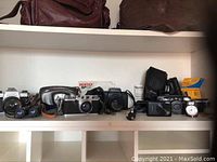 Overview of all cameras, flash, lenses, and bags