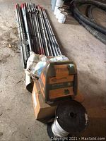 Overview showing energizer, fence tape spool, posts and accessories