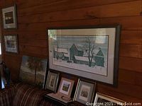 Long horizontal framed barn print and additional framed items on shelf
