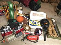 Wide view of lot displaying croquet mallets, basketball, football, pumps, and boxed sets