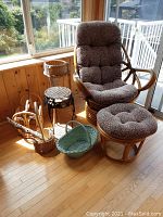 Rattan swivel chair and matching ottoman in sunlit room with multiple baskets in background