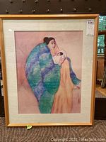 Full view of framed artwork showing subject, mat and frame