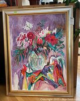 Full view of the floral oil painting in its frame, showing vibrant colors and detailed brushwork.