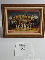 Complete view of framed Lakers 1980 Topps chewing gum team pinup photo.