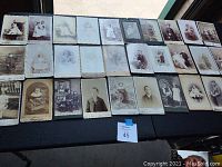 Lot of 33 vintage cabinet card photographs depicting children in various poses and settings from the 1800s.