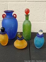 All five pieces arranged together showing scale and colors