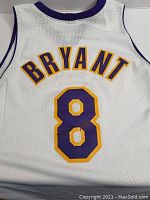 Back view showing BRYANT name and #8 on white mesh jersey