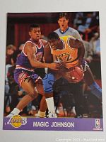 Full view of the signed Magic Johnson 8x10 photo in game action.