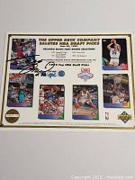 Image showing the full Upper Deck card with multiple basketball action shots and a signature of Shaquille O'Neal.
