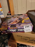 Photo shows one boxed Roto Matic rotary tool with 60-piece bit set in packaging with product branding and labeling visible.