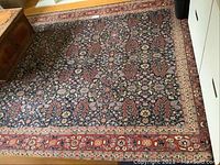 Full view of rug showing overall pattern, colors and placement in room