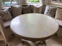 Round table top in bay window seating area