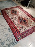 Full view of the rectangular rug placed on a tiled floor