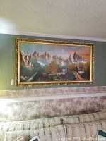 Overall view of large framed painting hanging above couch