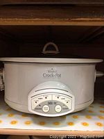 Rival Crock-Pot slow cooker front with controls on slow mode and glass lid