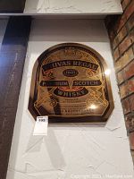 Front view of the Chivas Regal bar mirror showing branded details and overall shape