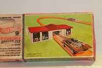 Box front showing artwork of Hot Wheels Super-Charger Sprint Set with track and car illustration.