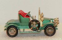 Side view showing the detailed green body, red interior and gold accent parts of the 1911 Maxwell Roadster diecast model.