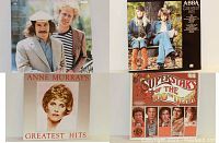 Photo showing six album covers including Northern Lights, ABBA Greatest Hits, Anne Murray Greatest Hits, Superstars of the 100th Year, The Bells and Simon & Garfunkel Greatest Hits.