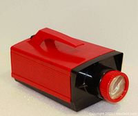 Side view of the red and black "Give A Show" slide projector with handle
