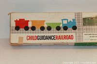 Original Child Guidance Railroad box showing colorful train illustrations on the side panel with brand name and railroad track design.